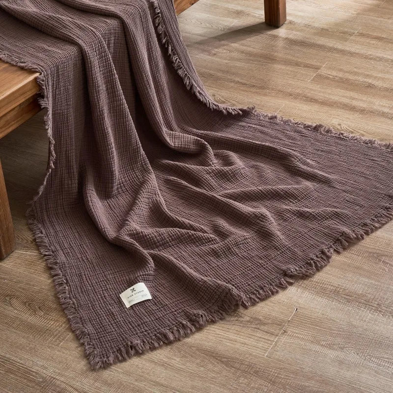 Plaid mauve en coton pour canapé